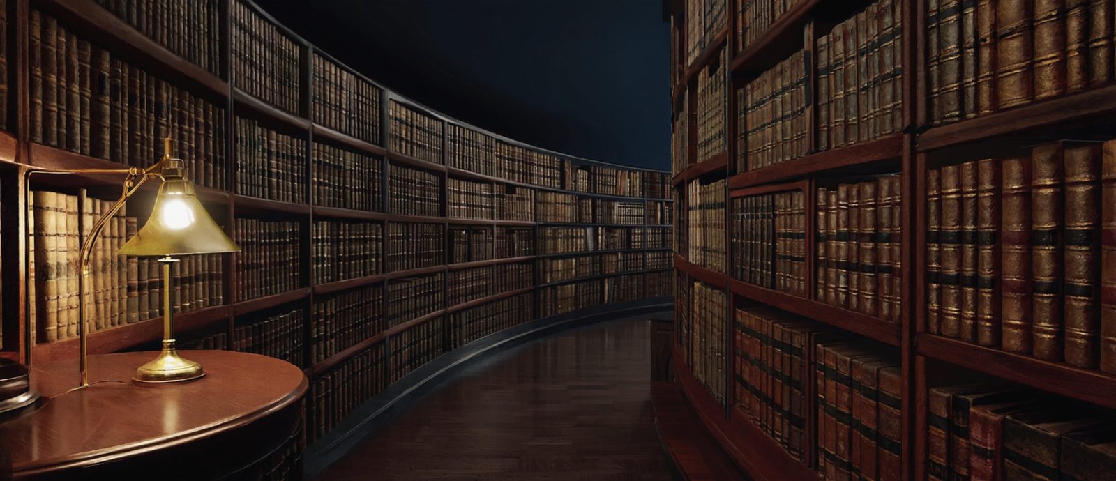 A round library at night, lit by one brass reading lamp.